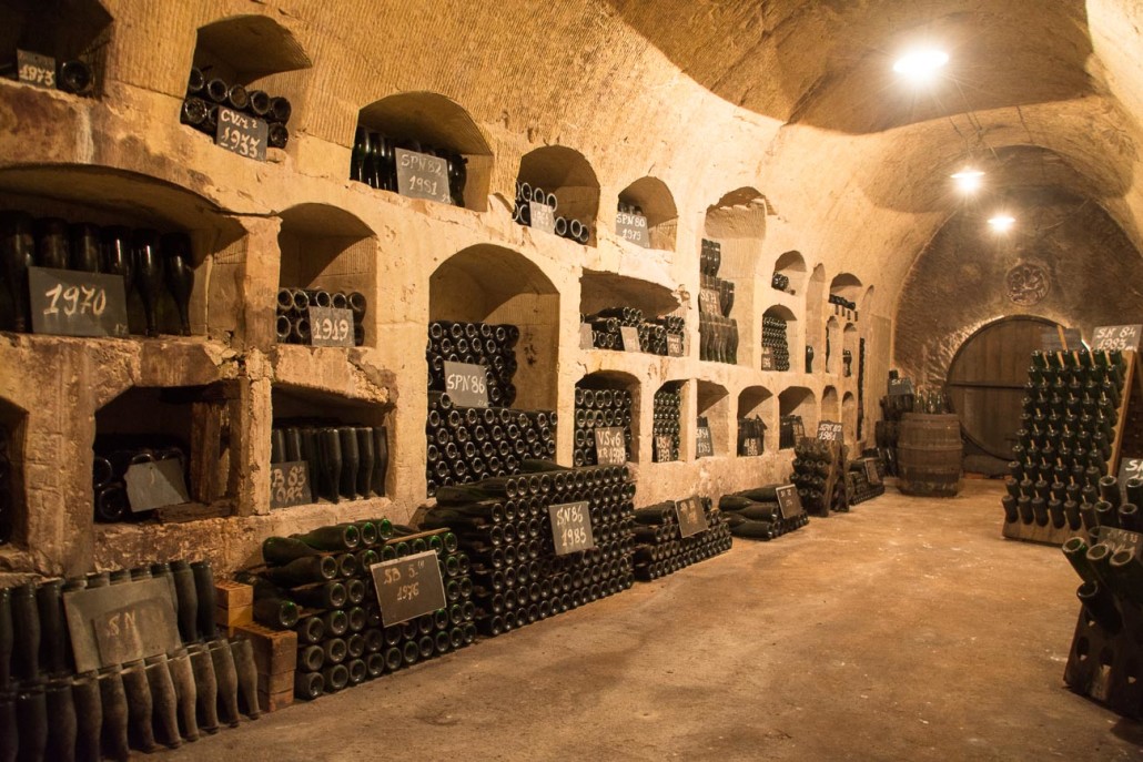 The cool of the champagne cellar was a welcome respite from the heat of the day