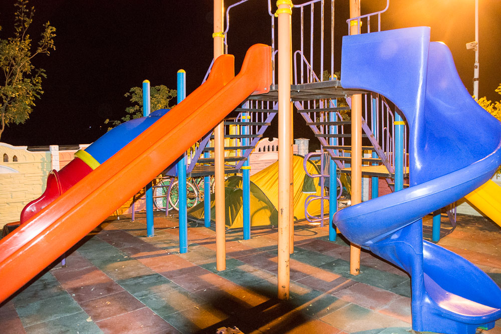 We were shattered, so could have slept anywhere. Just as well because the friendly staff at a service station east of Karahamzalı, Turkey, showed us the place to pitch our tent: a children’s play area! Can you see our tent? Sadly for some kids, we blocked the entrance to the climbing frame for the night.