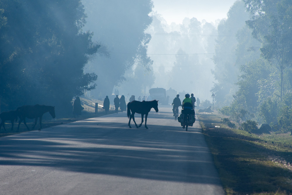 The morning air is filled with smoke from fires in people's houses.